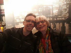 2016-12-22 12.08.51 Mom joined at Arlanda where we had lunch (in front of a photo of some other city :-))